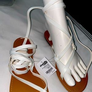 White tie up gladiator sandals.